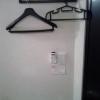 レンタルルーム ビスタ(新宿区/ラブホテル)の写真『５号室　ハンガーとエアコンのリモコン。部屋が狭いので、このハンガーとフックは助かる。』by セイムス