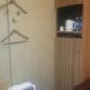 HOTEL Meria (ホテル メリア)(松戸市/ラブホテル)の写真『308号室　ソファー横の備品類収納家具とハンガー掛け、空気清浄器』by YOSA69