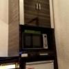 ホテル PASHA RESORT(パシャリゾート)(新宿区/ラブホテル)の写真『203号室電子レンジと冷蔵庫。上の棚は茶器がある』by 春風拳