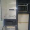 柏ハイランド(柏市/ラブホテル)の写真『405号室　備品類収納家具の扉を開けた景色（左上；コーヒーサービスセット、左下；アダルトグッズ販売器、右上；電子レンジ、右下；販売用冷蔵庫）』by YOSA69