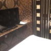 HOTEL AUGUSTA(荒川区/ラブホテル)の写真『652号室　ベッド足側のテレビ』by へんりく