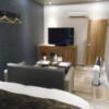 HOTEL M.（エムドット）(嬉野市/ラブホテル)の写真『110号室、ベッドから入口を見る。TV、冷蔵庫、湯沸かし等』by 猫饅頭
