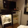 HOTEL ZERO MARUYAMA(渋谷区/ラブホテル)の写真『101号室のテレビ 下の備品類 冷蔵庫には無料のお水ボトルあり。』by angler