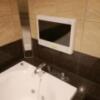 HOTEL VICTORIA RESORT(茅ヶ崎市/ラブホテル)の写真『305号室,浴室TVです。(22,7)』by キジ
